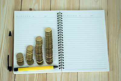 High angle view of coins on table