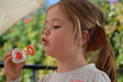 Close-up of girl eating food