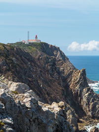 Scenic view of sea and buildings against sky