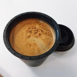 High angle view of coffee cup on table