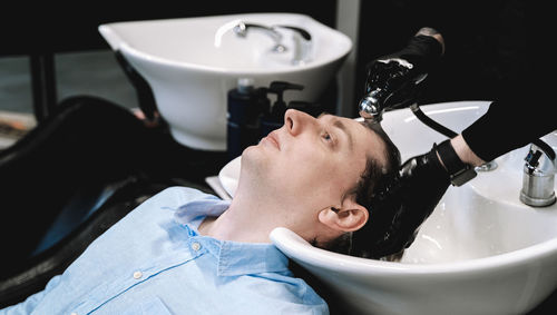 Portrait of young man in bathroom