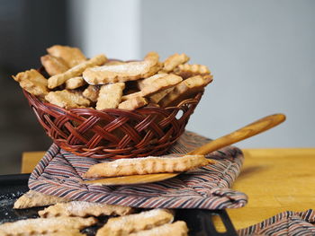 Close-up of cookies in basket on table