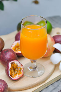 Close-up of orange juice on table