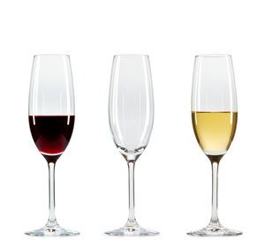 Close-up of wineglass against white background