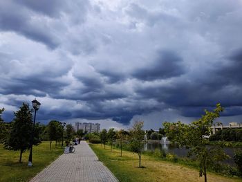 Panoramic view of trees and plants against cloudy sky