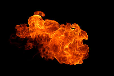 Close-up of fire against black background