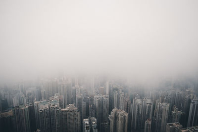 Aerial view of modern buildings in city against sky