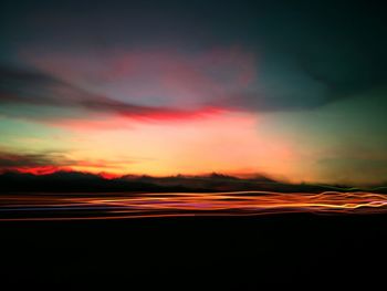 Silhouette landscape against sky during sunset
