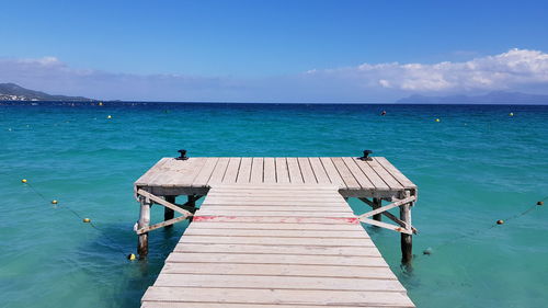 Pier on sea against sky