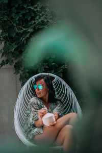 Midsection of woman holding drink