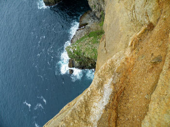 High angle view of cliff at sea shore