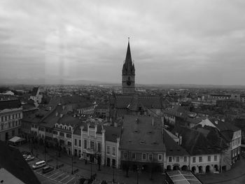 Aerial view of cityscape against sky