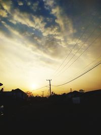 Silhouette landscape against sky during sunset