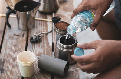 Cropped hands of person preparing coffee