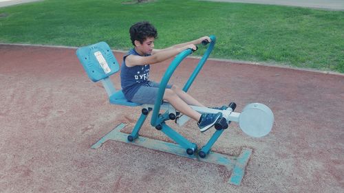 High angle view of boy exercising in playground