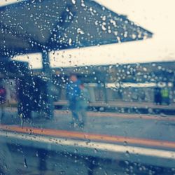 Road seen through wet car window