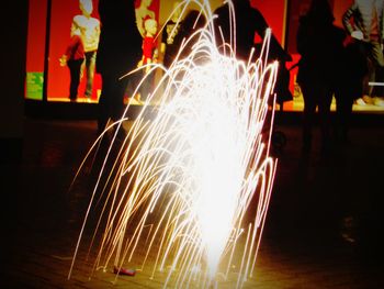 Close-up of illuminated lighting equipment at night