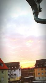 Low angle view of building against sky at sunset