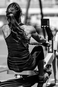 Rear view of athlete exercising on equipment