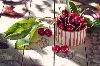 High angle view of cherries in container on table