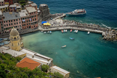 High angle view of buildings by sea