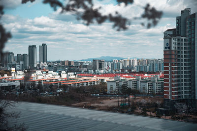 Modern buildings in city against sky