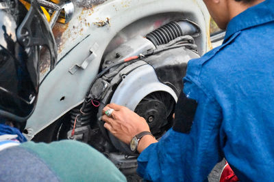 Midsection of man working in bus