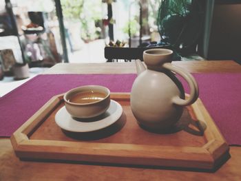 Close-up of cup on table