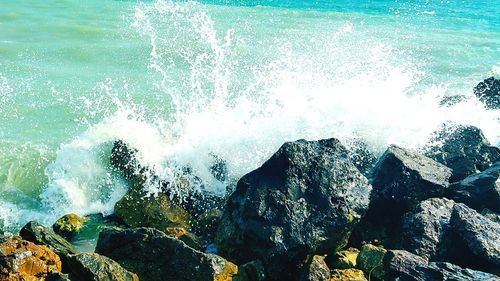 View of waves splashing on rocks