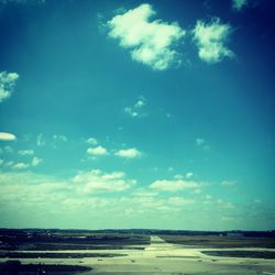 Scenic view of landscape against blue sky