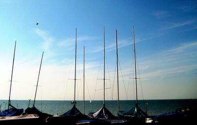 Boats in sea against sky
