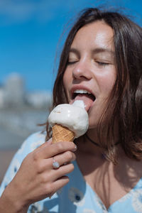 Close-up of woman eating ice cream