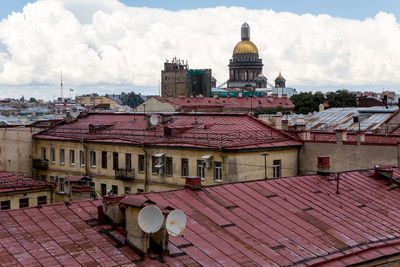 St. isaac cathedral by architect auguste montferrand. roofs of the old houses