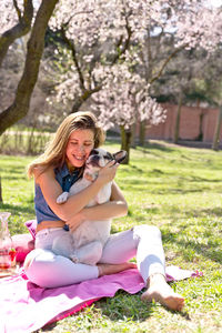 Young woman sitting on field