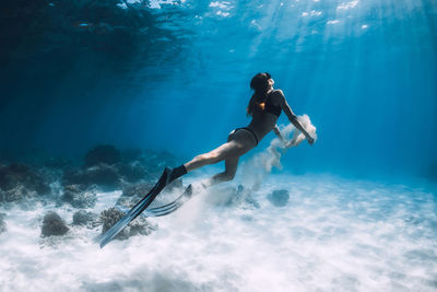 Full length of woman swimming in sea