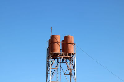 Low angle view of water tower against clear sky