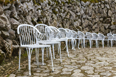 Empty chairs and tables in snow