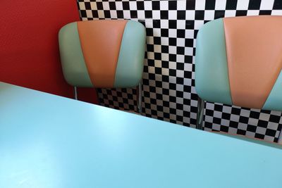 High angle view of chairs on table