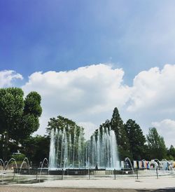 Fountain with trees in background