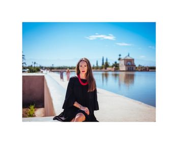 Portrait of woman against sky