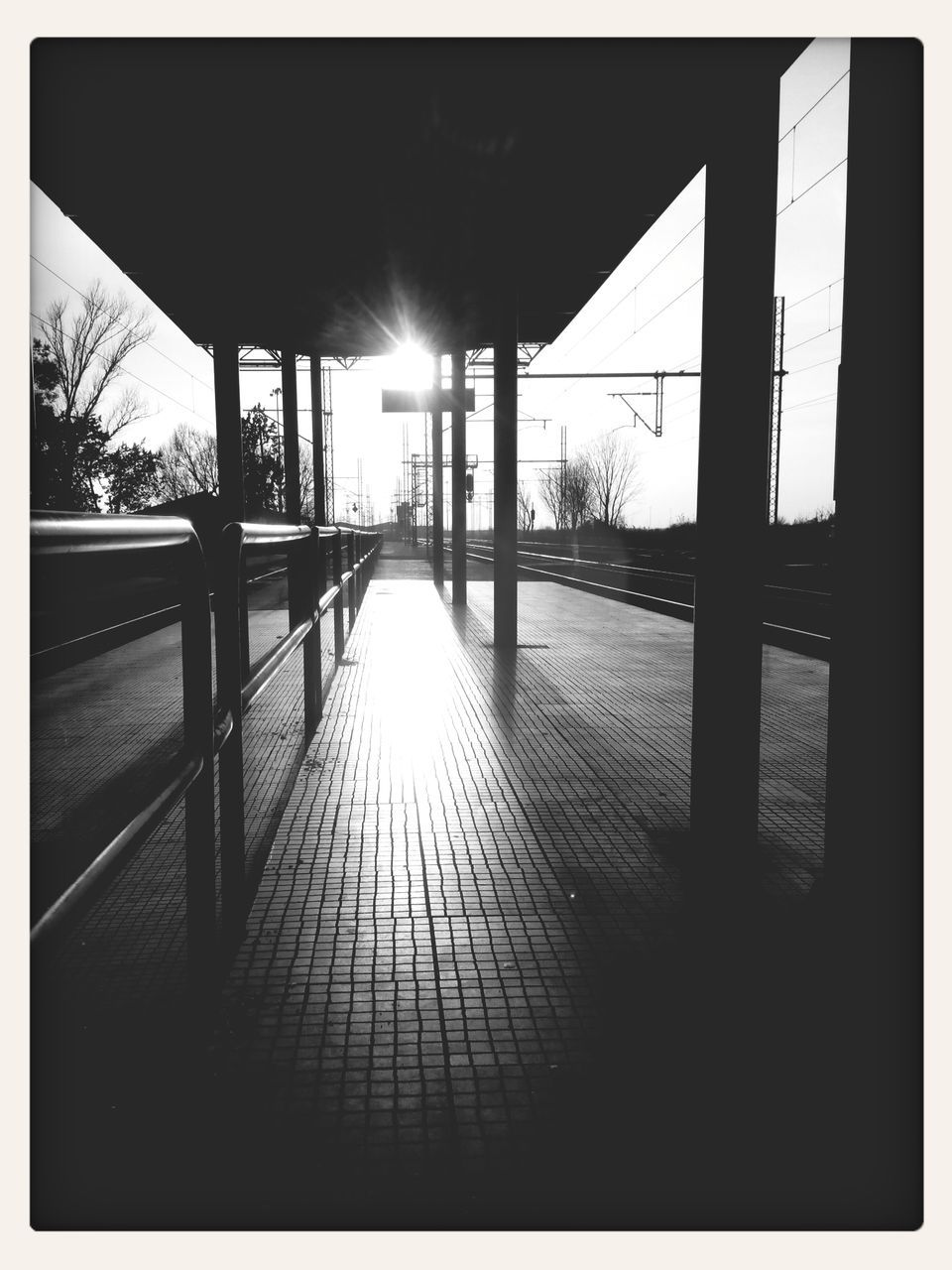 transfer print, auto post production filter, built structure, sunlight, architecture, indoors, railing, the way forward, empty, sun, sunset, absence, walkway, narrow, shadow, water, sunbeam, no people, long, dark