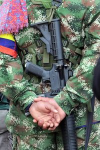 Rear view midsection of army soldier with hands behind back wearing uniform