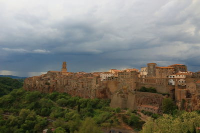 Townscape against cloudy sky