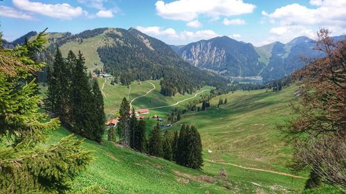 Scenic view of landscape and mountains against sky