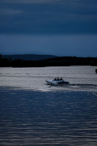 Boats in sea against sky