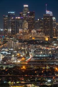 High angle view of illuminated buildings in city at night