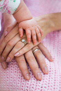 Close-up of family stacking hands