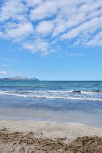 Scenic view of sea against blue sky