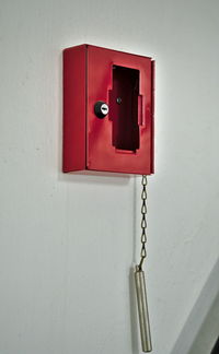 Close-up of telephone booth on wall