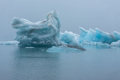 Floating icebergs in jokulsarlon glacial lagoon, iceland. global warming